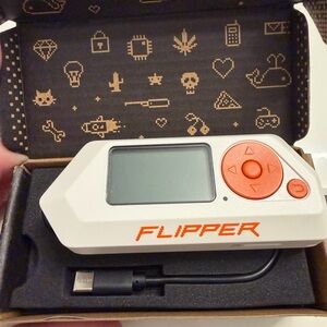 Flipper Device with Orange Accents